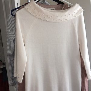 Elegant cream colored quarter sleeve top.